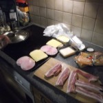 Bacon, cheese and ham sandwich cooked in bacon grease