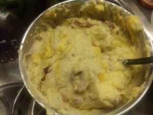 Making bacon and cheddar potato mash